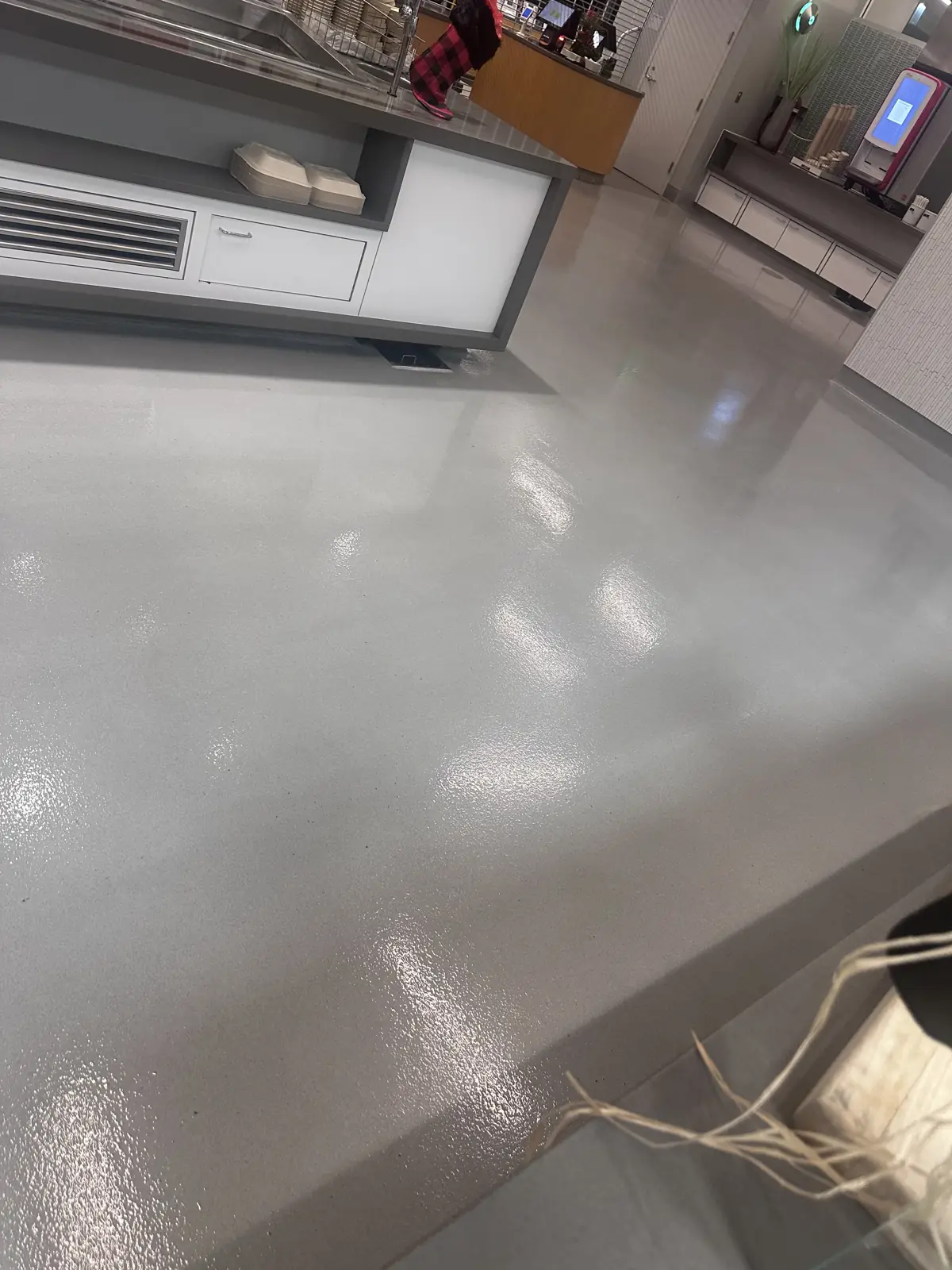 Refinished corridor floor reflecting light