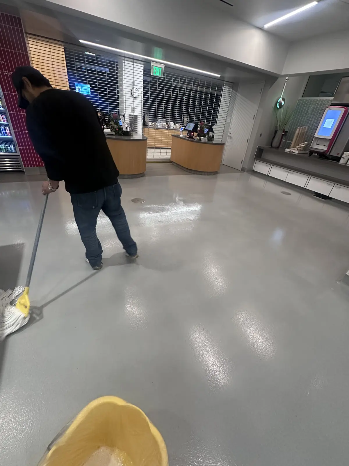Nexara crew laying floor finish in a commercial lounge